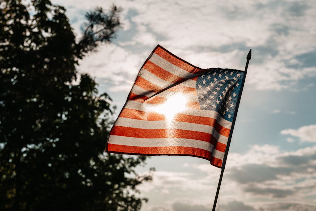 American Flag Under A Cloudy Sky